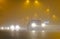 Cars driving in foggy weather in the city