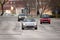 Cars driving on a public street in Split, Croatia. Silver Mazda MX-5 in focus, older model of the famous japanese sports car