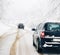 Cars driving in snow blizzard