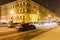 Cars driving on snowy Nevsky Prospect in night