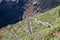 Cars driving on TF-436 mountain zig-zag road in Macizo de Teno mountains, island Tenerife, Canary, Spain. Starts in Masca and fini