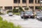 Cars driving trough big water pond after heavy rains fall in Dubai