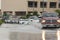 Cars driving trough big water pond after heavy rains fall in Dubai