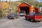 Cars entering covered bridge