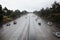 Cars on the freeway in rainy weather