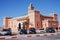 Cars in front of mosque in african Zagora town in Morocco