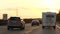 Cars on German autobahn highway at sunset