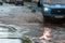 Cars after heavy rain driving in water flood, fixed route taxi-bus closeup