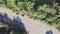 Cars highway traffic in forest, aerial scenic, unsaturated