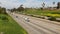 Cars on interstate highway California USA. Intercity freeway transport. Road traffic and greenery.