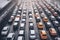 Cars lined up bumper to bumper on freeway during rush hour in winter