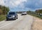 Cars Moves along a winding road in the mountains during