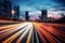 Cars moving at night on a highway captured in a long exposure, creating streaks of light