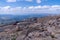 Cars parked along the side of the road along Mount Evans, a 14er mountain in the Arapaho and