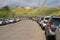 Cars parked along the side of the road, showing the difficult parking situation in