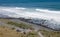 Cars parked at the bottom of the Cape Palliser Lighthouse in New Zealand