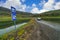 Cars parked on a dirt road In the midst of great nature Panoramic view of the valley and lake In the summer