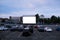 Cars parked in front of drive-in cinema screen