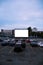 Cars parked in front of drive-in cinema screen