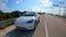 Cars parked near the Catos Bridge drawbridge where people go snorkeling