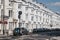 Cars parked outside white terraced houses on a street in Paddington, London, UK