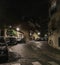 Cars parked on a quiet cobblestone street at night on Montmartre, Paris, France