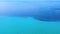 Cars passing on road next to beautiful blue sea. Exotic summer travel concept . Aerial view