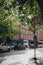 Cars queue in traffic on Hampstead High Street in the rain, London, UK, selective focus