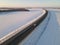 Cars on the road surrounded by winter fields. Aerial view