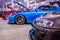 Cars in a row with open hoods at Hot Import Car Show in Honolulu, Hawaii