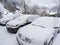 Cars snow-covered in snowy landscape of Norway