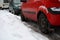 Cars on snow-cowered street