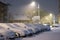 Cars in snow after snowstorm in night, winter photography and snow calamity