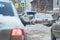 Cars on a snowy city street when there is lot of snow