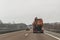 Cars and special purpose vehicle for wet waste disposal on an autobahn, Germany