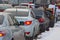 Cars stuck in traffic on a winter street