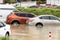 Cars stuck in water in a flooded parking lot after heavy in rain in Dubai