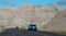 Cars traveling through Badlands National Park