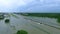 Cars and trucks trying to drive through flooded i45 near Houston Texas