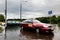 Cars trying to drive against flood on the street in Gdansk, Poland.