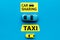 Carsharing vs taxi concept. Comparing carsharing system and taxi. Toy cars and text signs on blue background top view