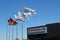 CARSON, CALIFORNIA - 11 MAY 2022: Flags and sign at the Porsche Experience Center where drivers can enjoy a variety of experiences