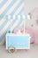 Cart with Candy Bar. Children zone with sweets: lollipops, ice cream and candy bar. Children room with blue stripe background. can