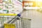 Cart at the grocery store. Abstract blurred photo of store with trolley in department store bokeh background.