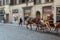 A cart with a horse and a cab driver are waiting for tourists, Florence, Italy.