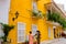 CARTAGENA, COLOMBIA 22, 2017: Unidentified people walking and buying handicrafts in Cartagena city street with colorful