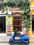 Cartagena, Colombia. August 30, 2019 - colorful house and blue motorcycle, moped or private transportation in the streets of