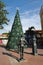 Cartagena de Indias, Bolivar/Colombia, December 10, 2017: Some statues looking at a decorated christmas tree on a square in
