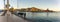 Cartagena, Spain - December 2, 2017: Yung man makes picture of promenade using smartphone. Panoramic view of Cartagena Murcia port