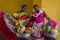 Cartegena, Colombia - December 15, 2015 - Two women proudly display their colorful dresses